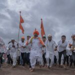 Vibrant cultural celebration with participants in traditional attire at Pandharpur, India.