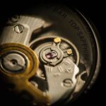 Detailed macro shot of a watch mechanism highlighting gears and jewels.