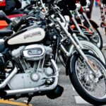 Classic Harley Davidson motorcycles lined up outdoors, capturing a street vibe.