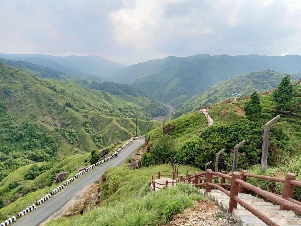 Beautiful green valleys and a winding road in South West Khasi Hills, India.
