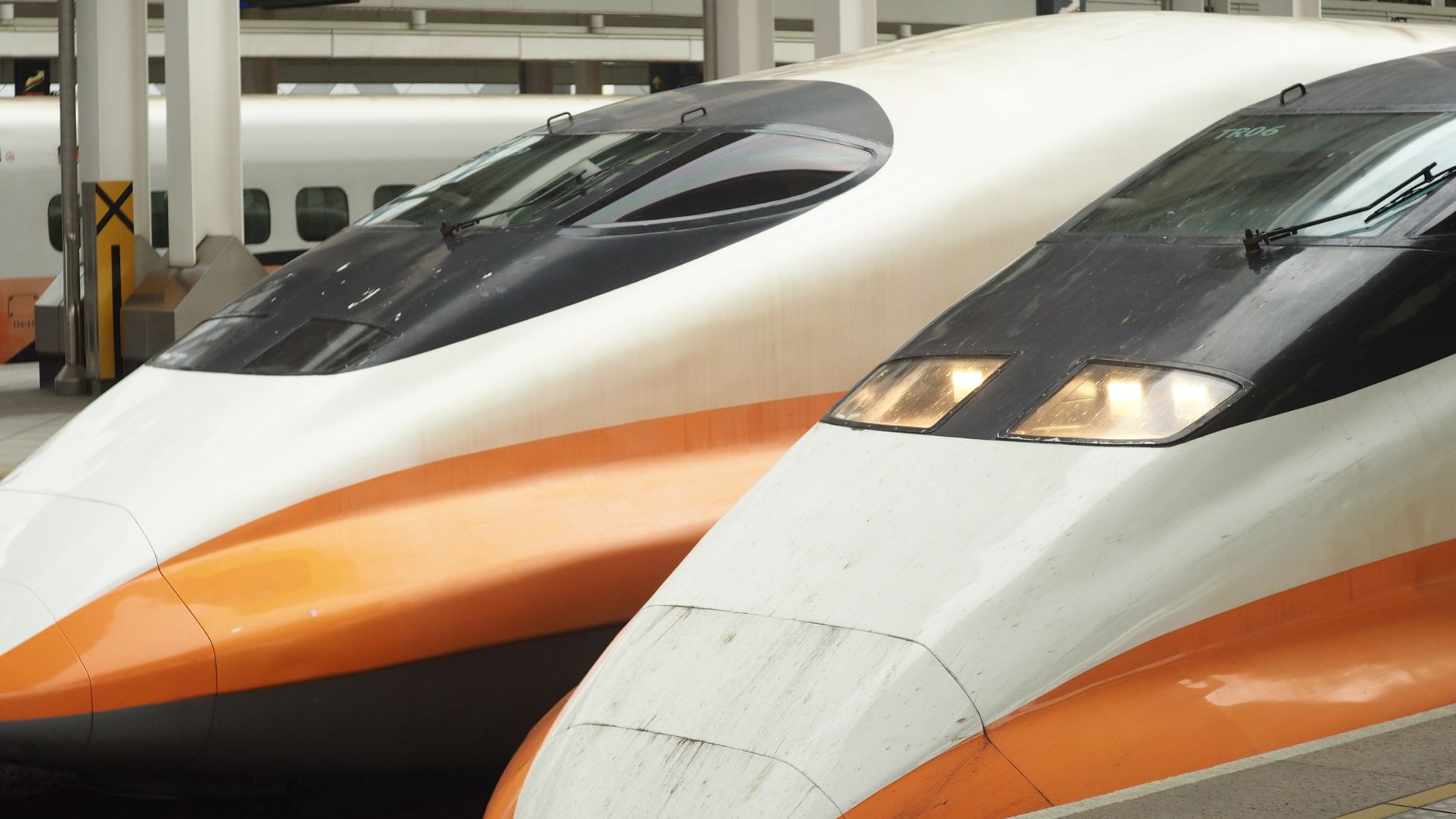 Close-up of high-speed trains at a modern station platform.