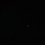 Creative abstract image of particles on a black background resembling a starry night sky.