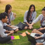 A group of college students studying together on a sunny day in Dimapur, India.