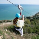 Experience the thrill of ziplining over a scenic Bulgarian landscape with breathtaking sea views.