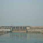 A serene view of a dam with a tranquil river in Gia Lai, Vietnam.