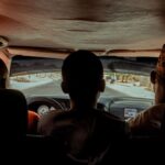 A scenic road trip view from the backseat of a car driving in Daura, Nigeria.