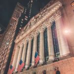 A striking night view of the New York Stock Exchange's illuminated facade in Manhattan.