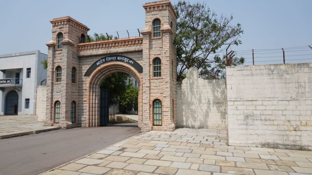 Stone entrance of a historic jail with arches and towers in Nanded, India.