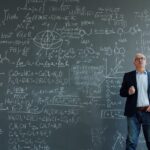 Professor standing in front of a blackboard filled with complex equations and scientific formulas.