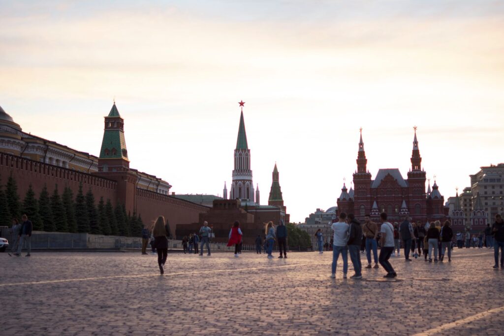 Visitors enjoy the iconic Red Square in Moscow, a UNESCO site, at sunset.