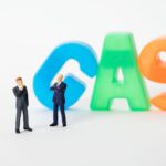 Creative image of toy businessmen with colorful gas letters, symbolizing industry concepts.