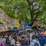 Students gather in New Delhi for a peaceful protest, displaying banners and signs at Jantar Mantar.