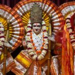 Vibrant statues of Hindu deities adorned with intricate garlands and colorful attire.