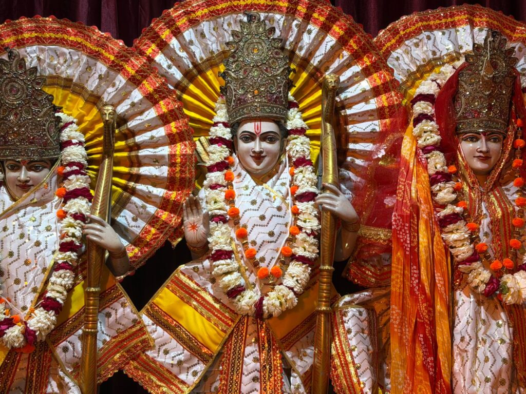 Vibrant statues of Hindu deities adorned with intricate garlands and colorful attire.