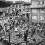 Rescue operations amidst earthquake destruction in Bhaktapur, Nepal. Soldiers sift through rubble.