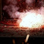 A mesmerizing explosion of firecrackers with vibrant red sparks lighting the scene.
