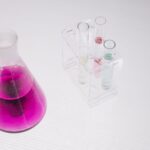 A vibrant chemistry setup with flasks and colored liquids in a lab.