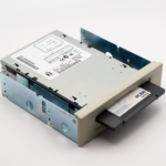 An old-fashioned PC100 data backup drive with a removable diskette, showcasing retro computing hardware.