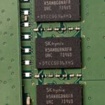 Detailed view of SK hynix DRAM chips on a green circuit board featuring electronic components.