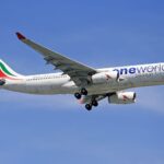 SriLankan Airlines Airbus A330 flying in clear blue skies, showcasing aviation in motion.