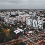 Drone shot capturing Chennai's bustling cityscape and modern architecture from above.
