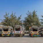 Brightly colored shared taxis parked in Hazaribagh, showcasing Indian vehicle art.