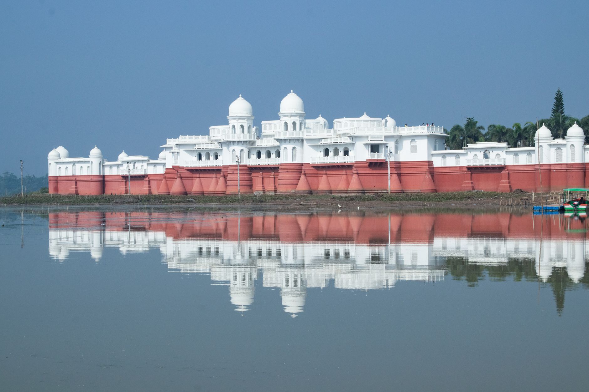 Stunning view of Neermahal Palace reflected in the serene waters of the lake in Agartala, India.
