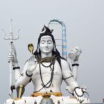 Impressive statue of Lord Shiva against a clear sky in Gangtok, Sikkim, India.