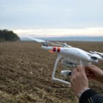 Drone preparation on a Ukrainian farm field, capturing rural landscapes and agriculture.