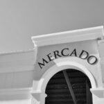 A black and white image of a mercado entrance with arch detail in the Dominican Republic.