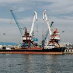 Cargo ships and cranes at the industrial port in Rasht, Gilan Province, Iran.