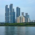 Panoramic view of modern skyscrapers in Seoul, South Korea with waterfront.