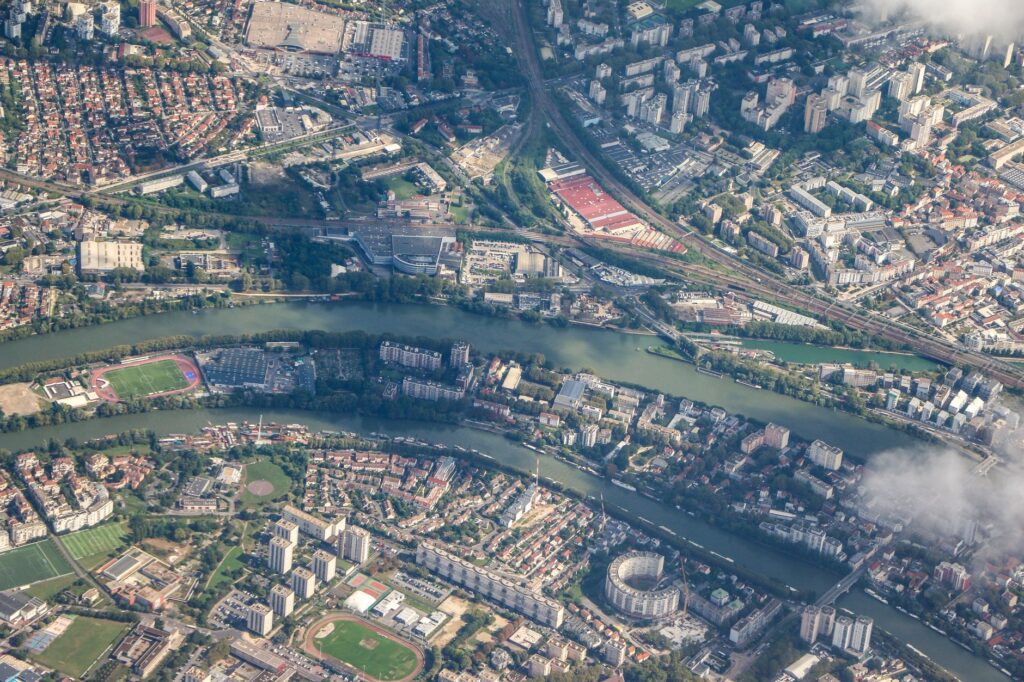 Stunning aerial view showcasing a city with a river running through urban landscapes.
