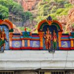 Colorful sculptures on a Hindu temple facade in Tirupati, India, showcasing intricate craftsmanship and religious symbolism.