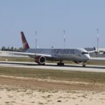 Virgin Atlantic airplane captured on runway during daytime, showcasing aviation and travel.