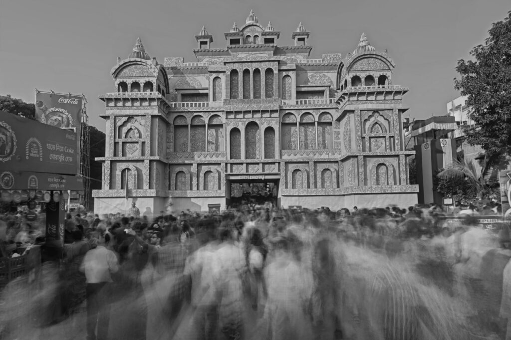 Crowds gather at a beautifully decorated pandal during Durga Puja in Kolkata, India.