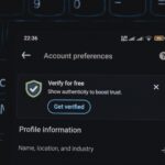 Close-up of a smartphone screen displaying account verification alert. Ideal for security and authenticity themes.