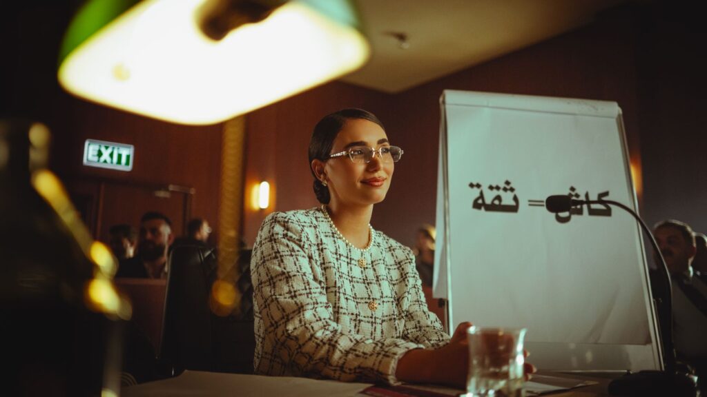 Businesswoman presenting with confidence at a corporate meeting in Baghdad, Iraq.