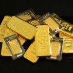 A collection of precious gold bars stacked elegantly, symbolizing wealth and prosperity.