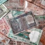 A collection of diverse vintage Indian rupee notes showcasing various denominations and designs.