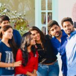 A cheerful group of friends capturing a memorable selfie together on a sunny day.