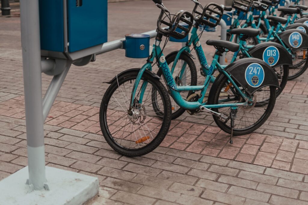 Row of blue rental bicycles at a station in Bandung, Jawa Barat, Indonesia.
