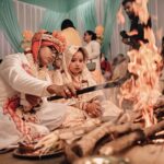 Beautiful Indian wedding ceremony in Assam featuring traditional rituals by the bonfire.