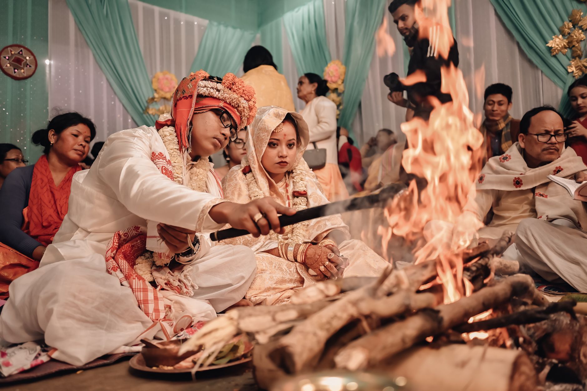 Beautiful Indian wedding ceremony in Assam featuring traditional rituals by the bonfire.