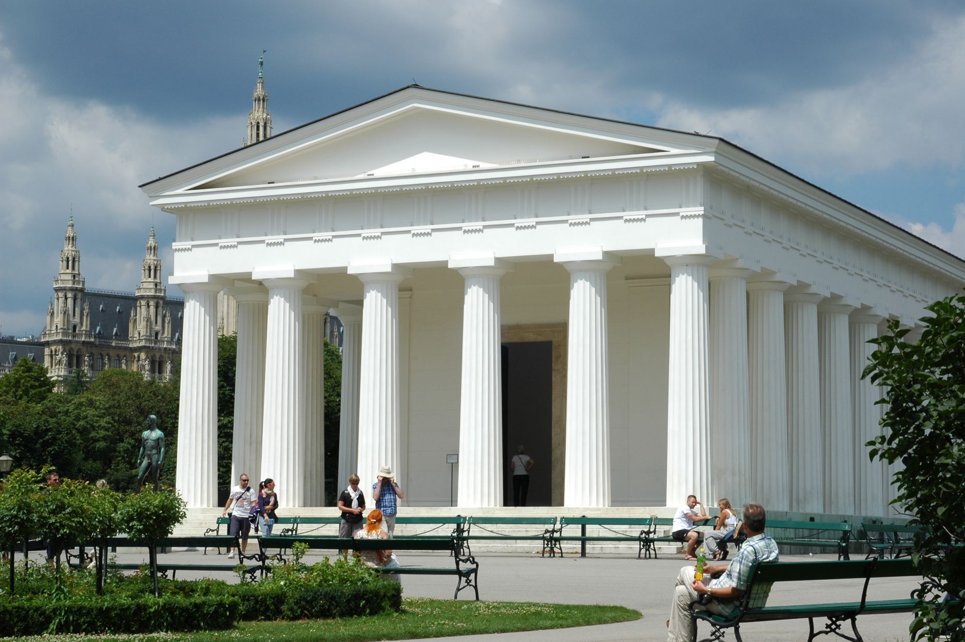 Captured in Burggarten, Vienna, this neoclassical temple stands against a vibrant city backdrop.