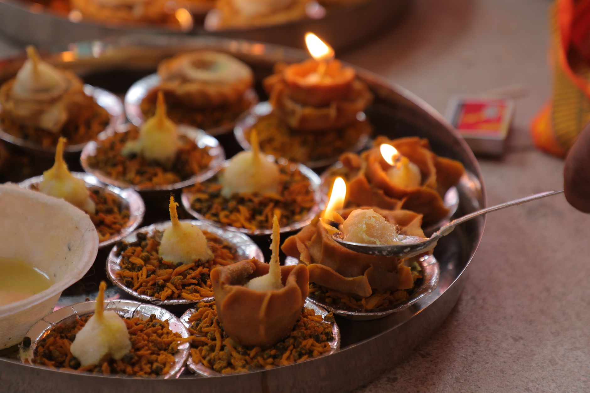A collection of traditional Indian diyas lit and beautifully arranged for a festive occasion.