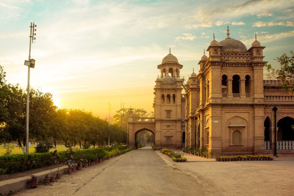 Beautiful view of Islamia College in Peshawar during sunset, showcasing historic architecture and a serene environment.