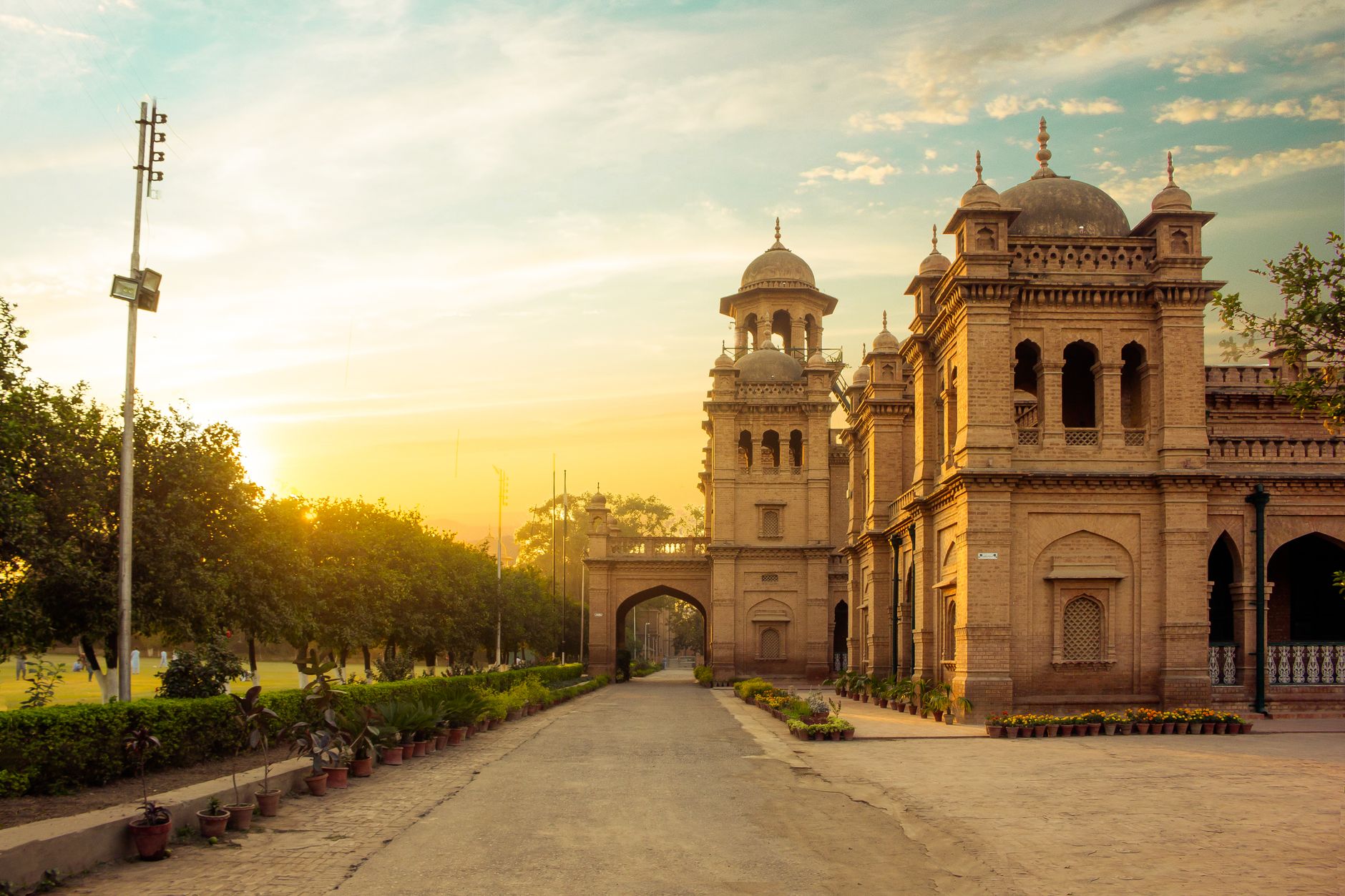 Beautiful view of Islamia College in Peshawar during sunset, showcasing historic architecture and a serene environment.