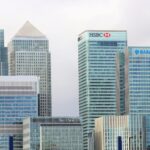 Modern skyline of Canary Wharf featuring iconic bank skyscrapers like HSBC and Barclays.