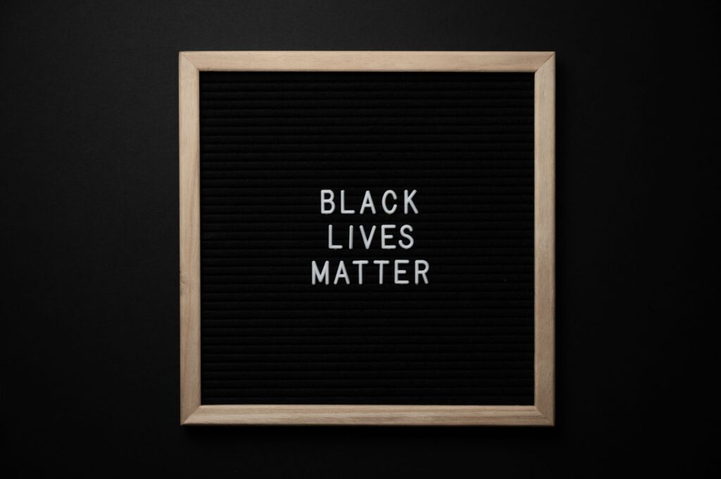 From above of sign Black Lives matter on black square framed signboard on black background